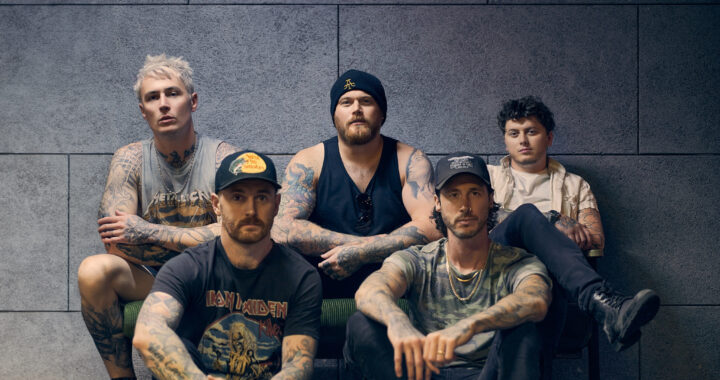 Asking Alexandria Band Members Sitting For A Cover Shot